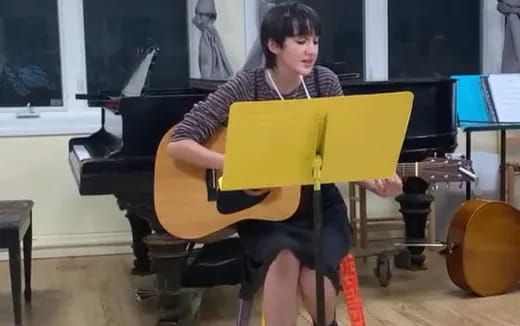 a person playing a cello