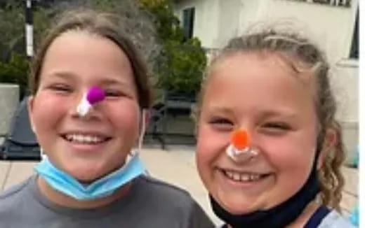 a couple of girls smiling