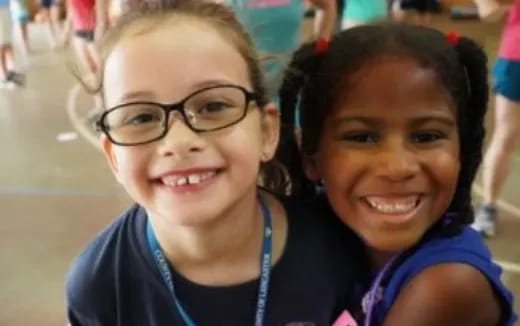 a couple of girls smiling