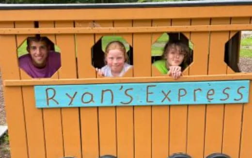 a group of people in a wooden frame