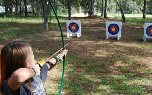 a child shooting arrows