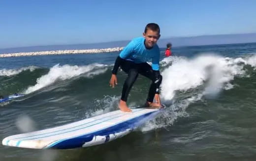 a man riding a surfboard