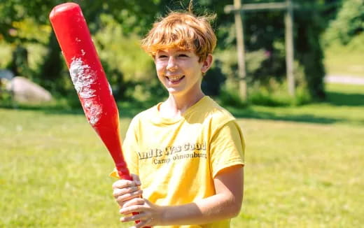 a boy holding a bat