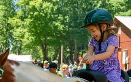 a girl riding a horse