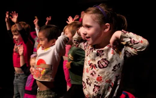 a group of children dancing