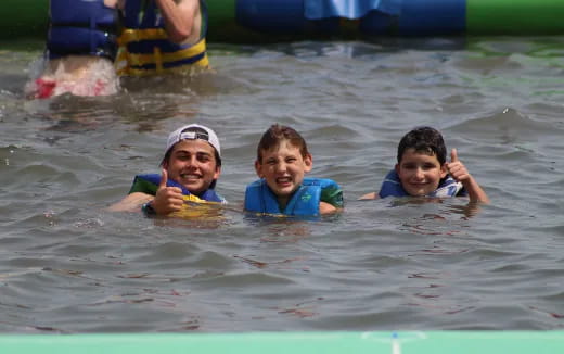 a group of people swimming in water