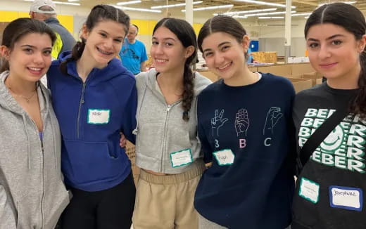 a group of women posing for a photo