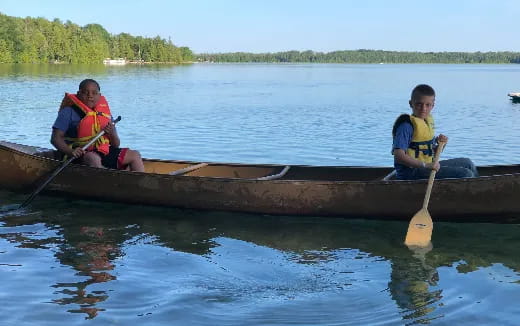 two boys in a canoe