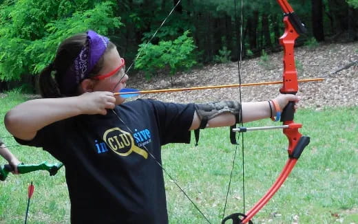 a person shooting bows