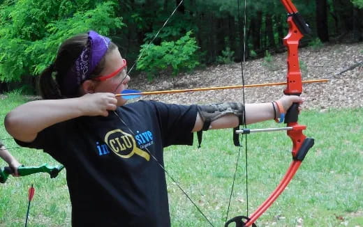 a person shooting bows