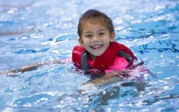 a boy in a pool