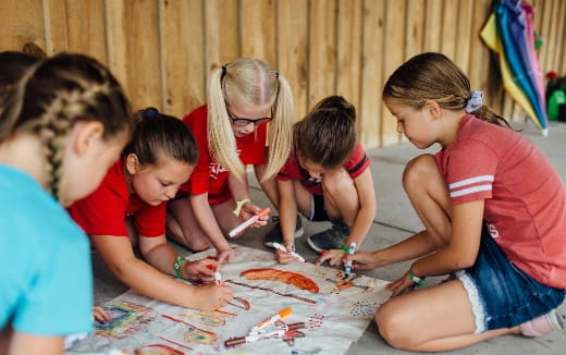 a group of children painting