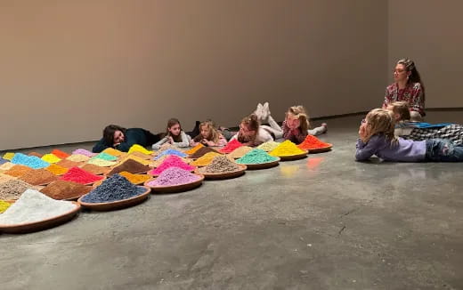 a group of people sitting on the ground