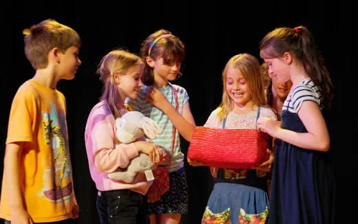 a group of people holding a baby
