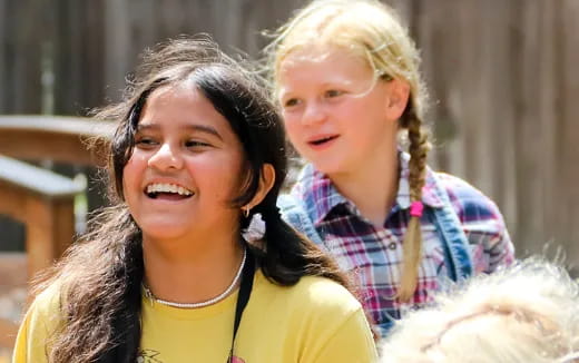 a woman and a girl smiling
