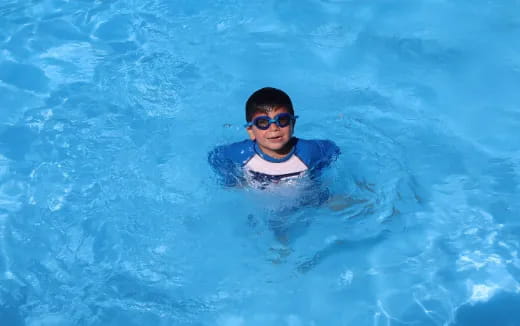 a man swimming in a pool