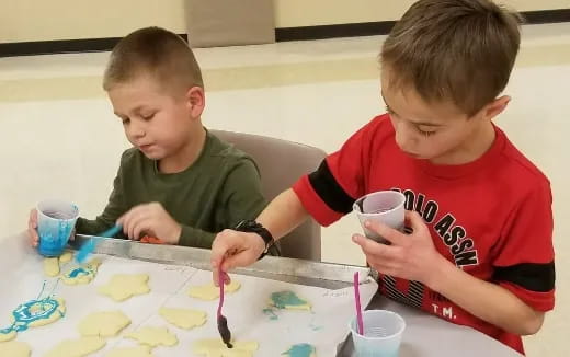 a couple of boys painting