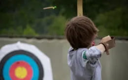 a child holding a stick
