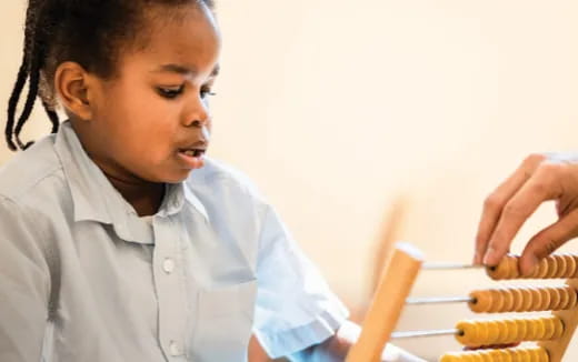 a young girl holding a stick