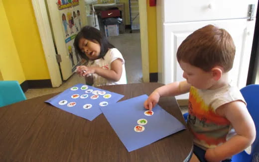 a couple of children playing with toys