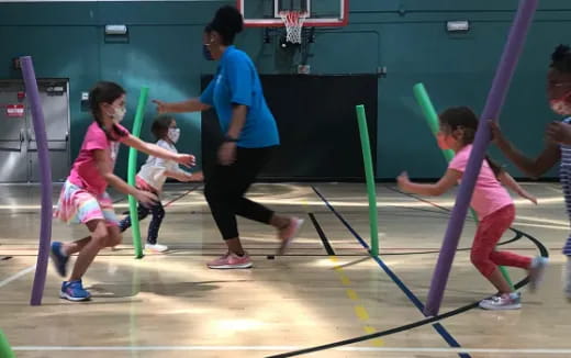 a group of people playing volleyball