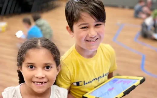 a couple of children smiling