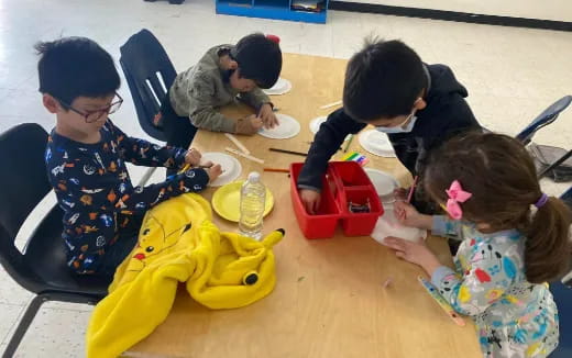 a group of children painting
