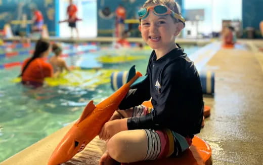 a boy in a pool