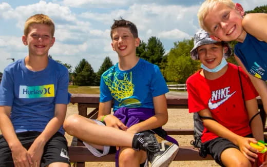a group of people sitting on a bench