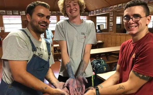 a group of men smiling