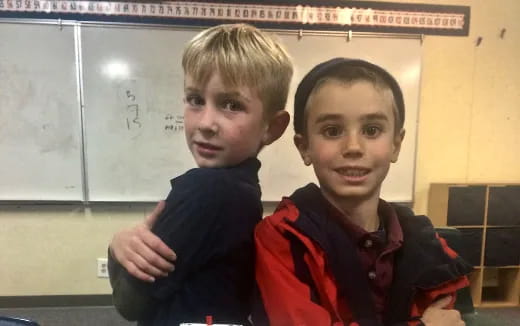 two boys standing together