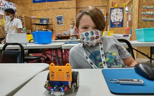 a young girl with a mask