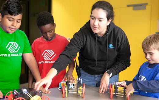 a group of people playing with toys