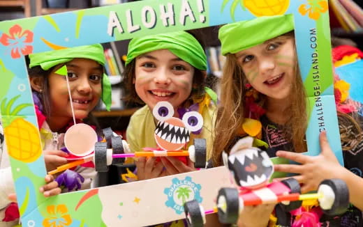 a group of girls holding a toy