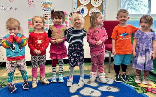 a group of children posing for a photo
