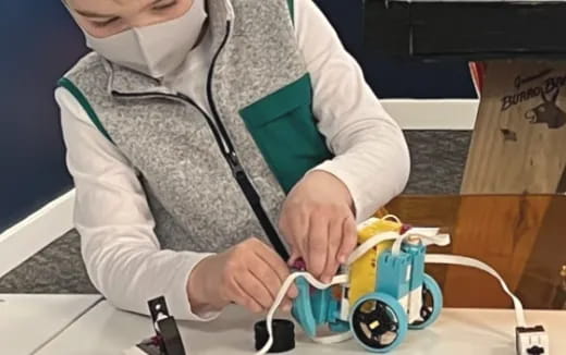 a person cutting a banana