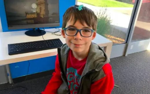 a boy wearing glasses