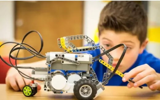 a group of people playing with a robot