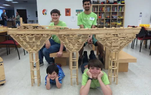 people using laptops in a classroom