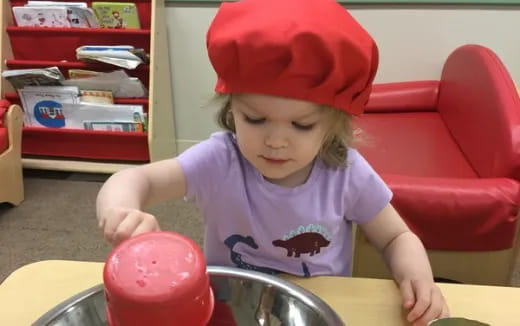 a child wearing a red hat
