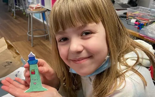 a girl holding a toy