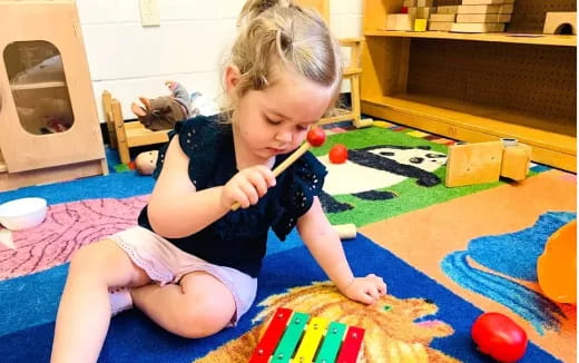 a girl playing with toys