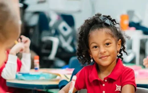 a young girl in a red shirt