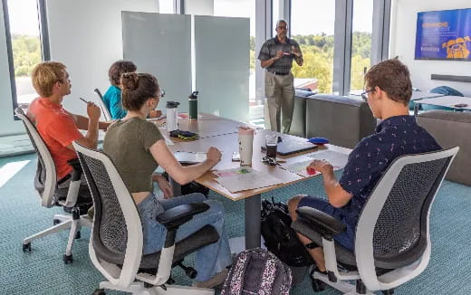 a group of people sitting around a table
