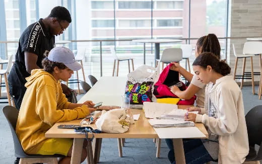 a group of people sitting at a table