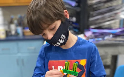 a boy wearing a mask