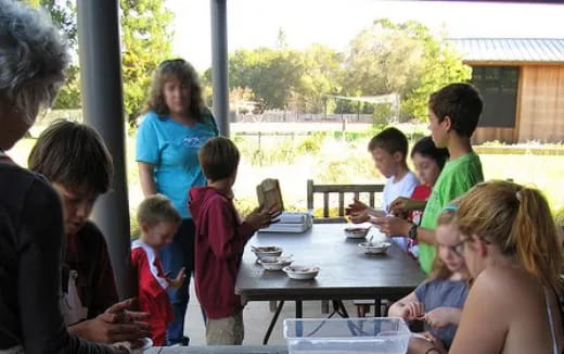 a group of people sitting around a table