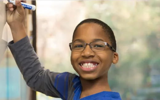 a boy wearing glasses