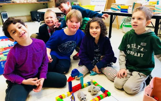 a group of children sitting on the floor