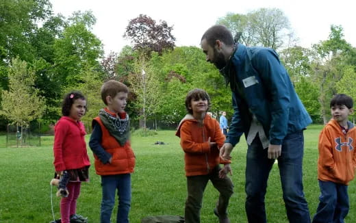 a person talking to kids